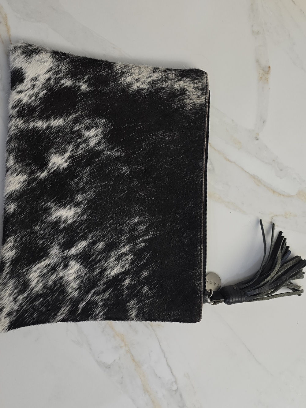 Ash Black and White Cowhide Tassel Clutch